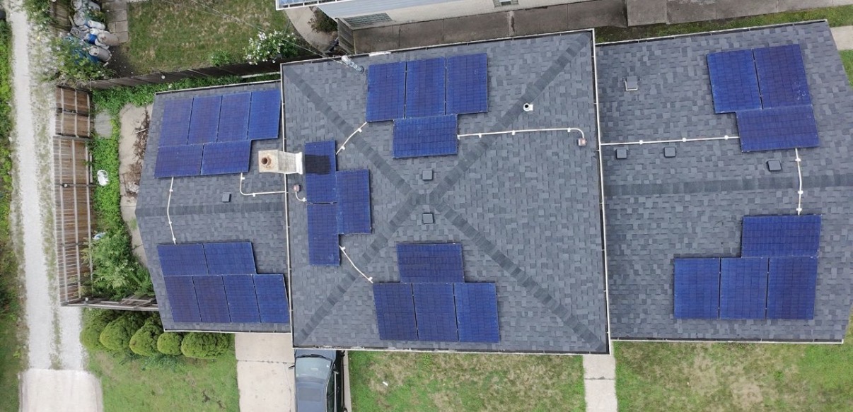 Aerial view of a completed solar panel installation on an Illinois residential roof